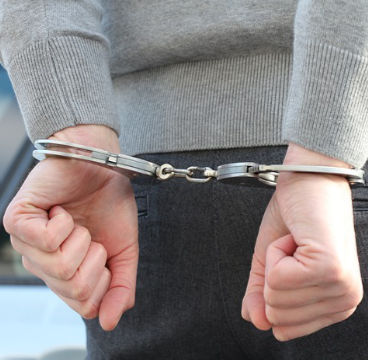 man arrested in handcuffs